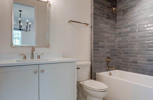 Secondary Bathroom with Blue Tile Tub Surround by Christina Morris Design Secondary Bathroom with Blue Tile Tub Surround