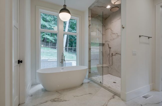 Primary Bathroom with Freestanding Tub & Walk-In Shower by Christina Morris Design Primary Bathroom with Freestanding Tub & Walk-In Shower