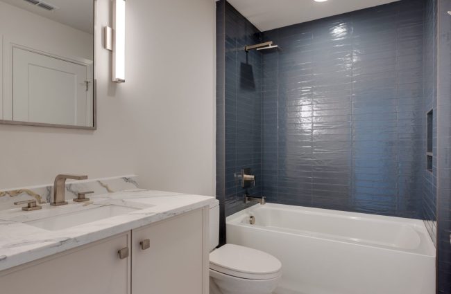 4032 General Bate Drive Nashville, TN Secondary Bath by Christina Morris Design | Home built by McKenzie Construction, Lighting & Plumbing from Ferguson Enterprises, Tile from GIO Tile Distributors, Countertops from MC Granite Nashville, Cabinets by Thomas Lain Cabinetry