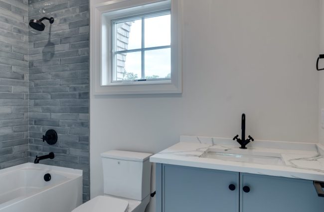 1214 Jefferson Davis Drive Nashville, TN Secondary Bath | Interiors by Christina Morris Design, Home Built by McKenzie Construction, Lighting and Plumbing from Ferguson Home, Tile from GIO Tile Distributors, Countertops from MC Granite Nashville, Cabinets by Thomas Lain Cabinetry 1214 Jefferson Davis Drive Secondary Bath by Christina Morris Design