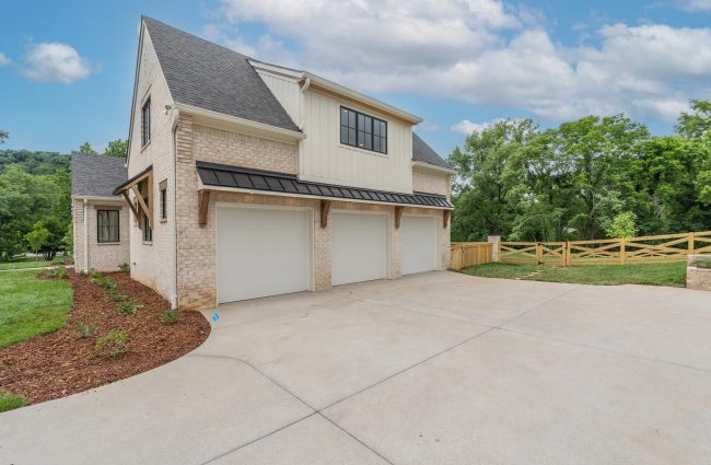 1214 Jefferson Davis Drive Nashville, TN | Exterior by Christina Morris Design, Home Built by McKenzie Construction, Brick from Alley-Cassity, Garage Doors from Cloplay, Windows from Pella 1214 Jefferson Davis Drive Exterior by Christina Morris Design