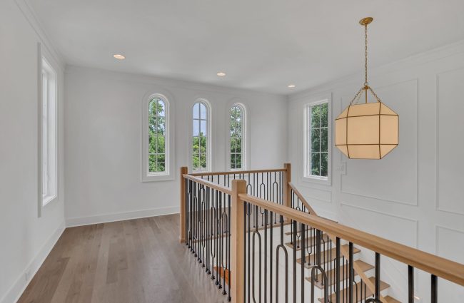 4108 Outer Drive Stair Landing | Interiors by Christina Morris Design, Home Built by McKenzie Constriction, Lighting from Ferguson Home, Railing Pieces from Central Woodworks, Windows from Pella 4108 Outer Drive Nashville, TN by Christina Morris Design
