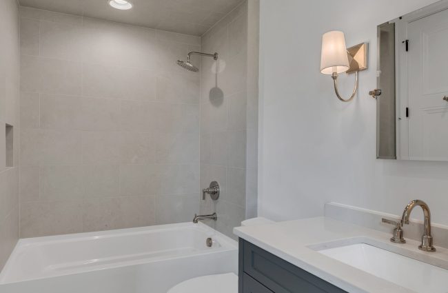 4108 Outer Drive Nashville, TN Secondary Bath | Interiors by Christina Morris Design, Home Built by McKenzie Construction, Plumbing and Lighting from Ferguson Home, Tile from GIO Tile Distributors, Countertops from MC Granite, Cabinets from Thomas Lain Cabinetry 4108 Outer Drive Nashville, TN by Christina Morris Design